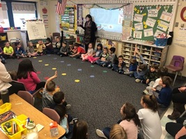 First Grade Students Make Butter the Old Fashioned Way