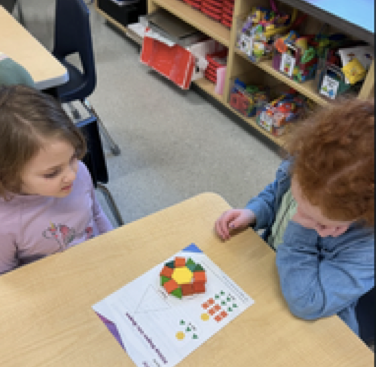 The students in Ms. Howard's class at Margaret Chase Smith School have launched Unit 5 in their new Reveal math program. In this unit, kindergarten students explore and identify various 2D shapes. The students have the opportunity to use pattern blocks to create larger shapes.