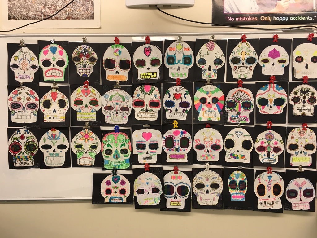 Cut paper and mixed media Sugar Skull artworks from 6th Grade Art.